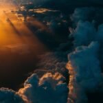 Pacific low cloud feedback: Dark layered storm clouds stretching across a wide sky