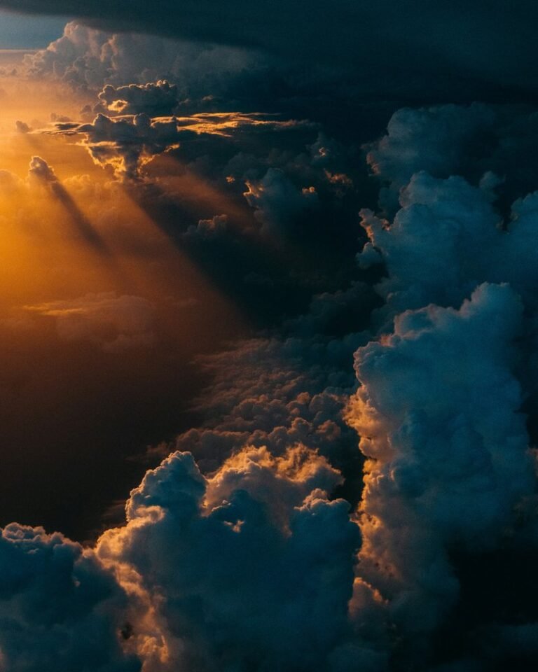 Pacific low cloud feedback: Dark layered storm clouds stretching across a wide sky