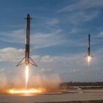 Rocket launching into a clear sky on a pillar of exhaust